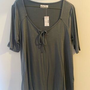 Olive green woman’s shirt.